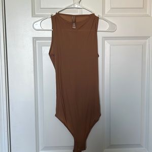 SKIMs body suit